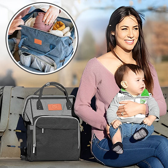 maman assise sur un banc avec son sac a dos a langer